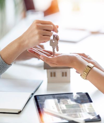 Handing over the. keys to a property.