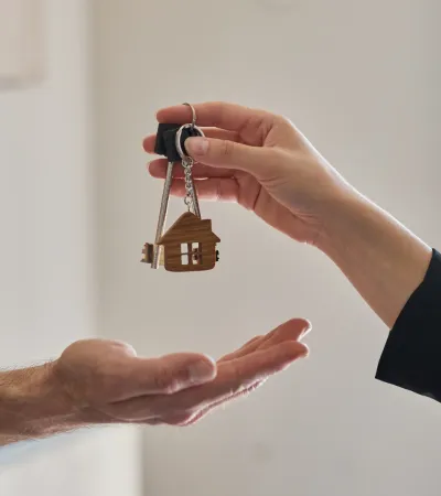 Person handing over keys.