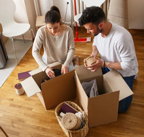 People unpacking moving boxes.