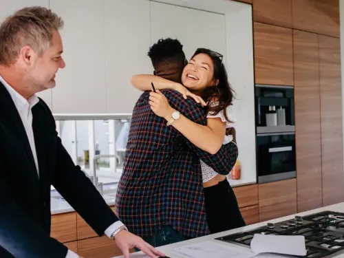 Couple happy about their new home.