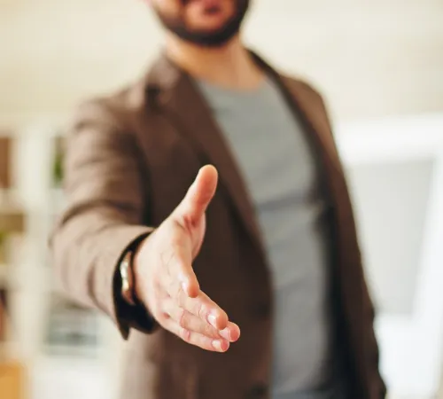 Man offering a handshake.