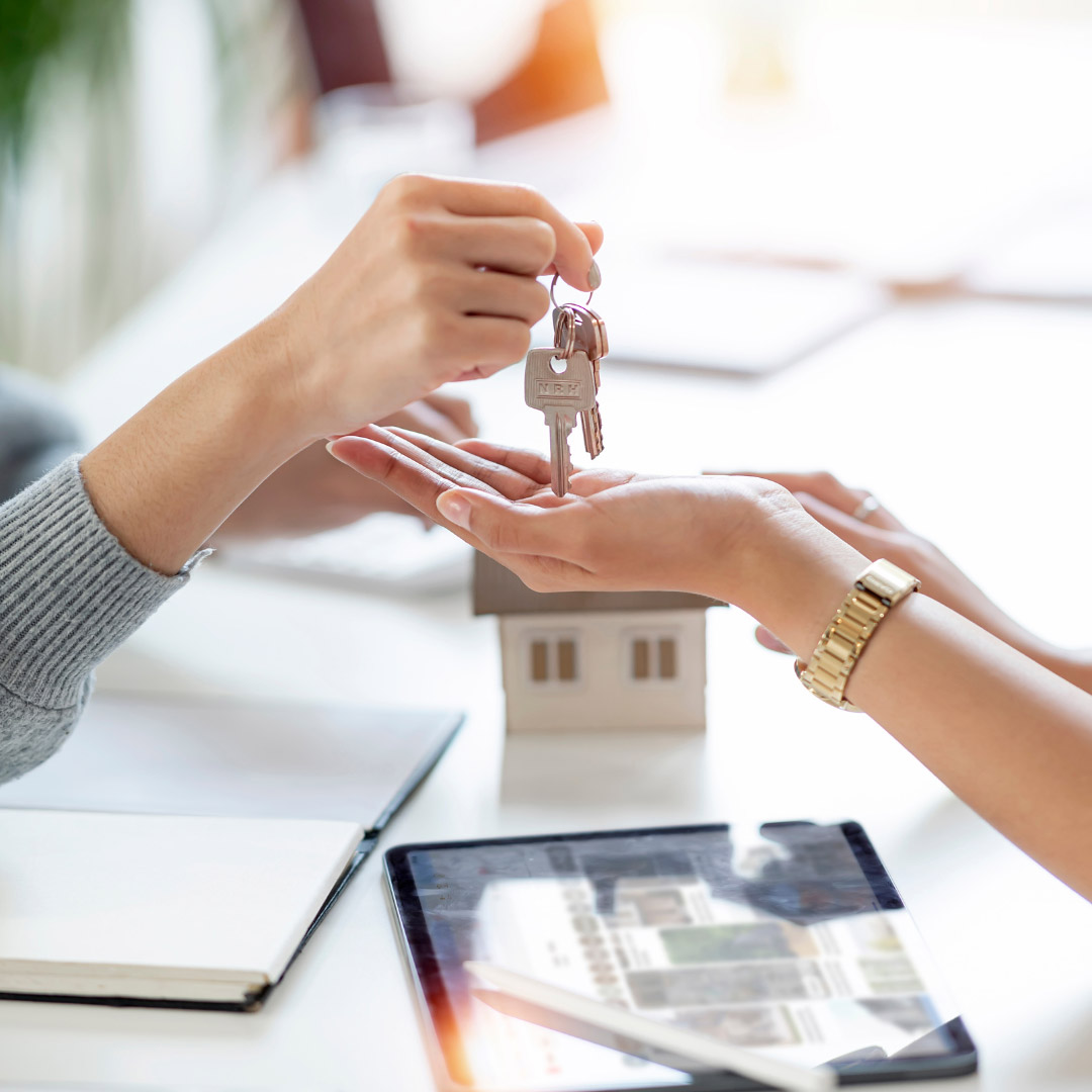 Handing over the. keys to a property.