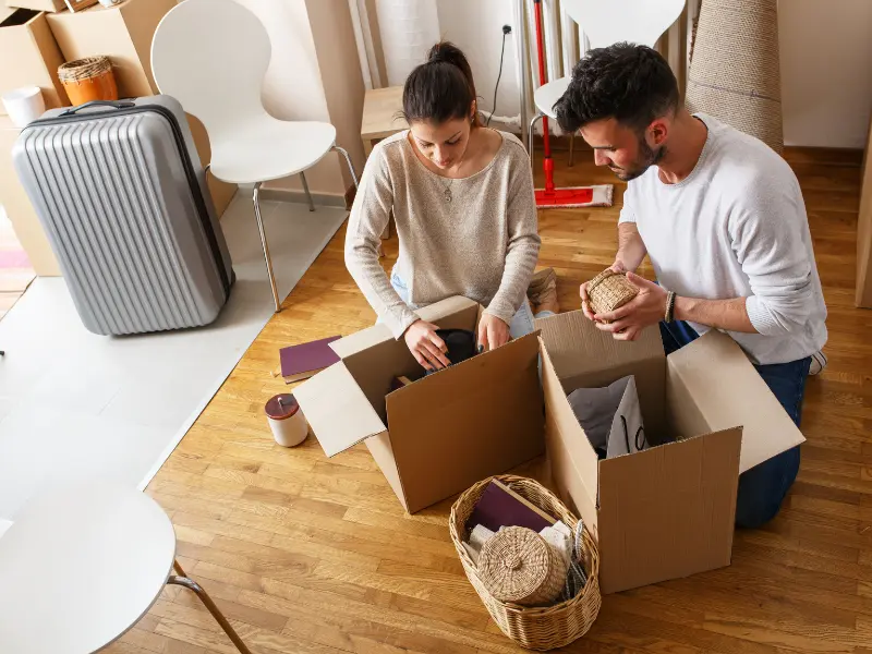 Couple packing to move.