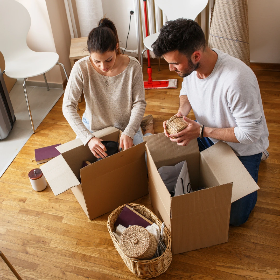 People unpacking moving boxes.