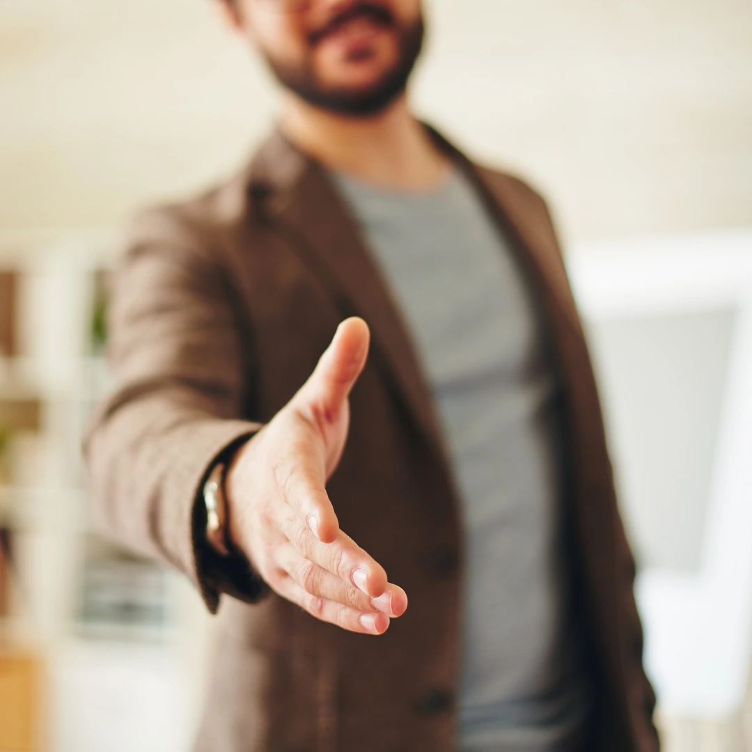 Man offering a handshake.